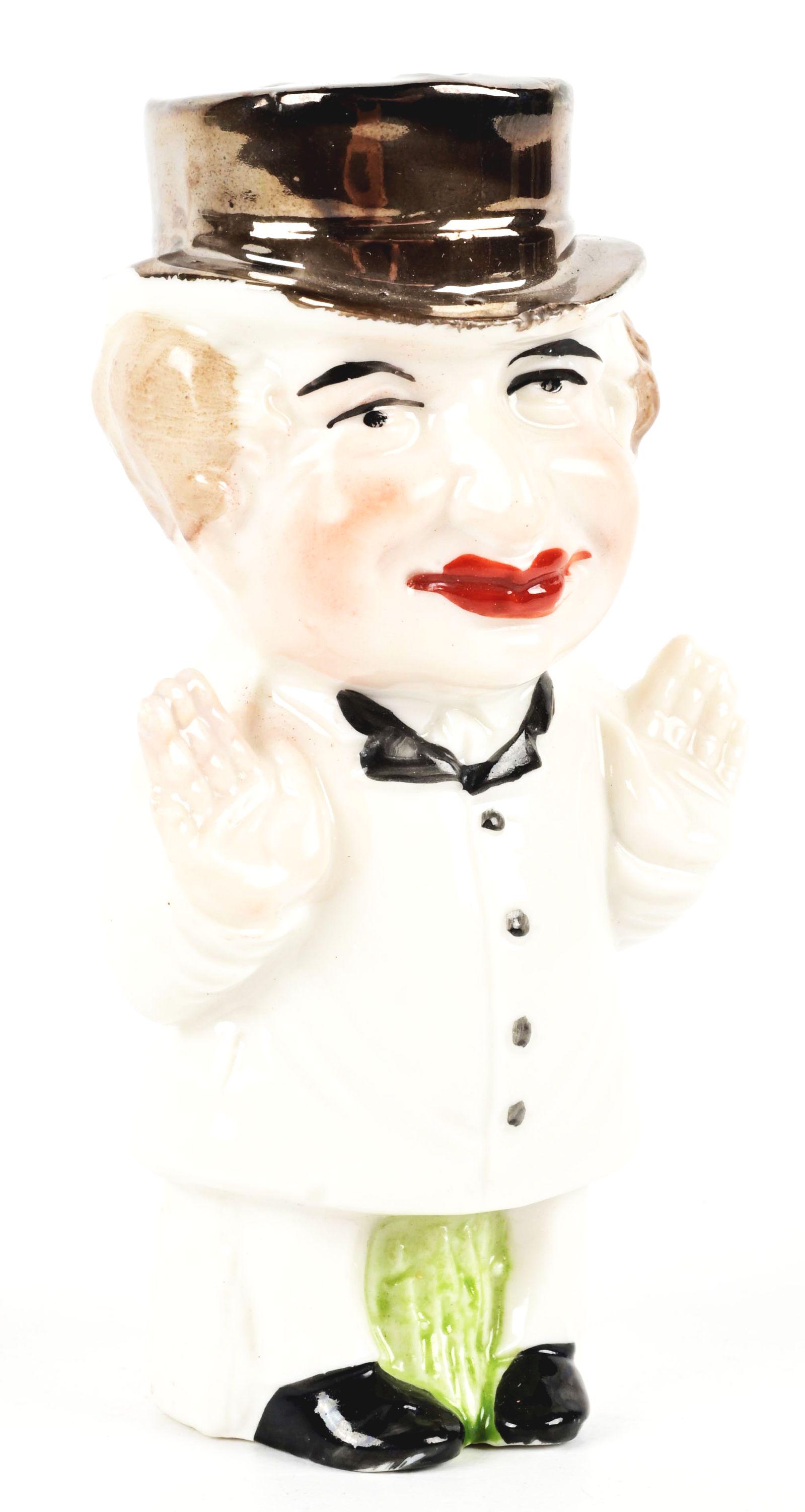 PORCELAIN STANDING FIGURE BANK. (1 of 4)