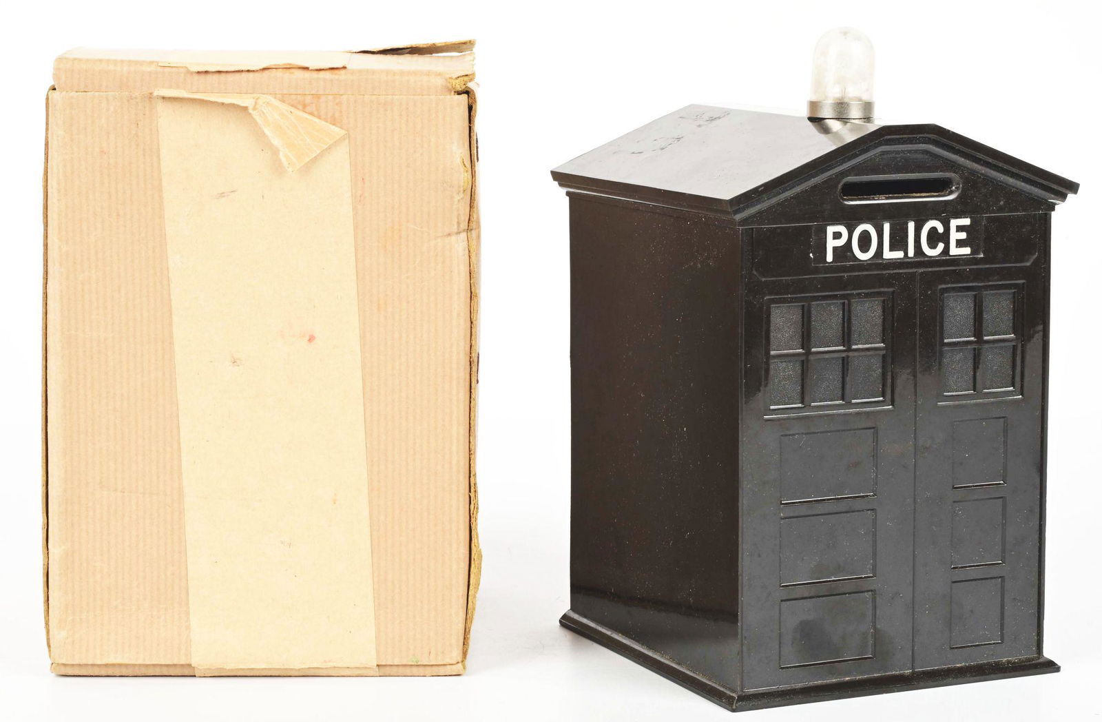 EARLY BAKELITE POLICE MONEY BOX.: In the original box. Reads "Police" on front where the coin slot is, and has a light on the top with a plastic bubble. Condition: (Very Good - Excellent). Dimensions: Box: 4 - 1/2" x 4 - 1/2" x 6 - 1/