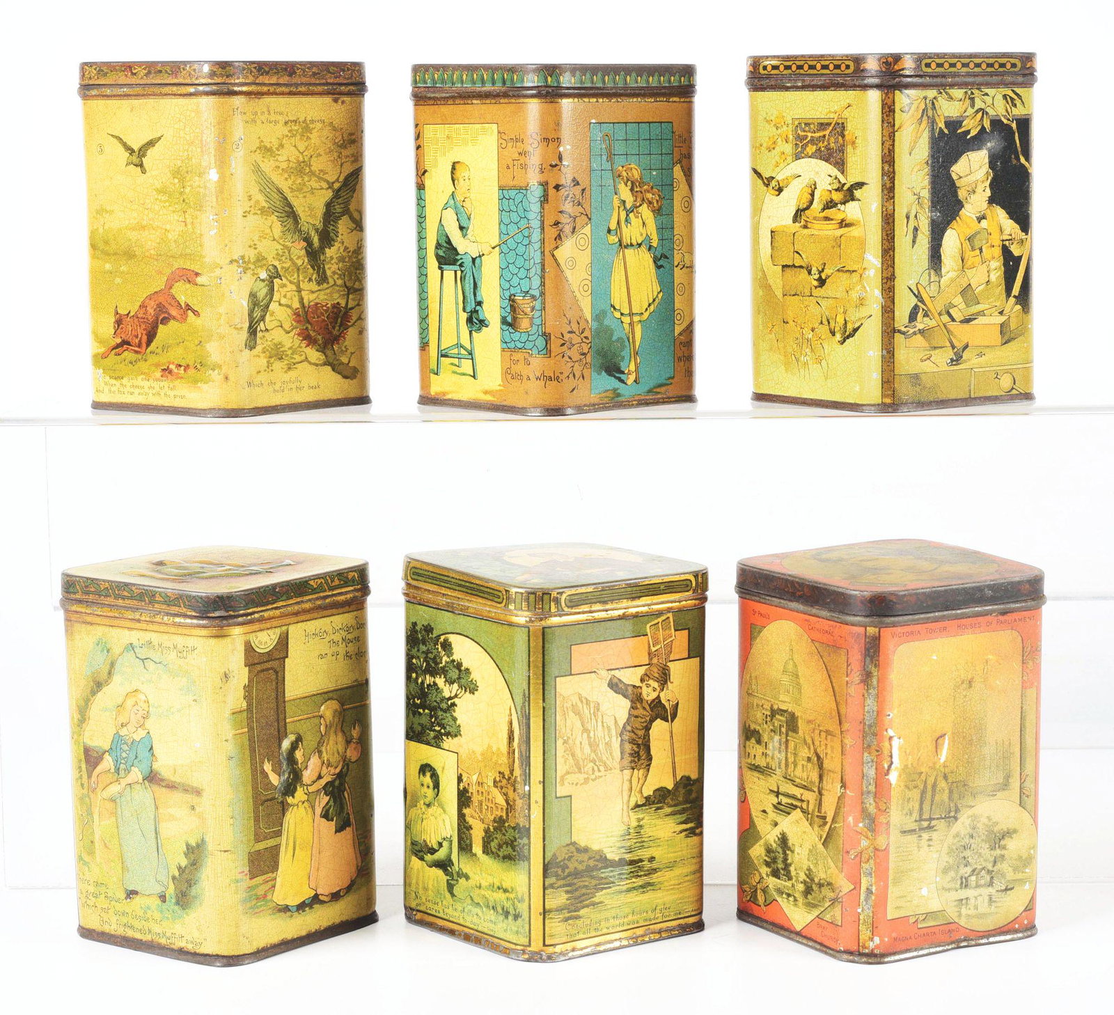 LOT OF 6: CARR'S "JUVENILE" BISCUIT TINS.: Lot of six Carr's "Juvenile" biscuit tins. The first has a scene on the lid of a young boy picking apples, with paper label on the inside of the lid, in very good condition. Second has a picture on th