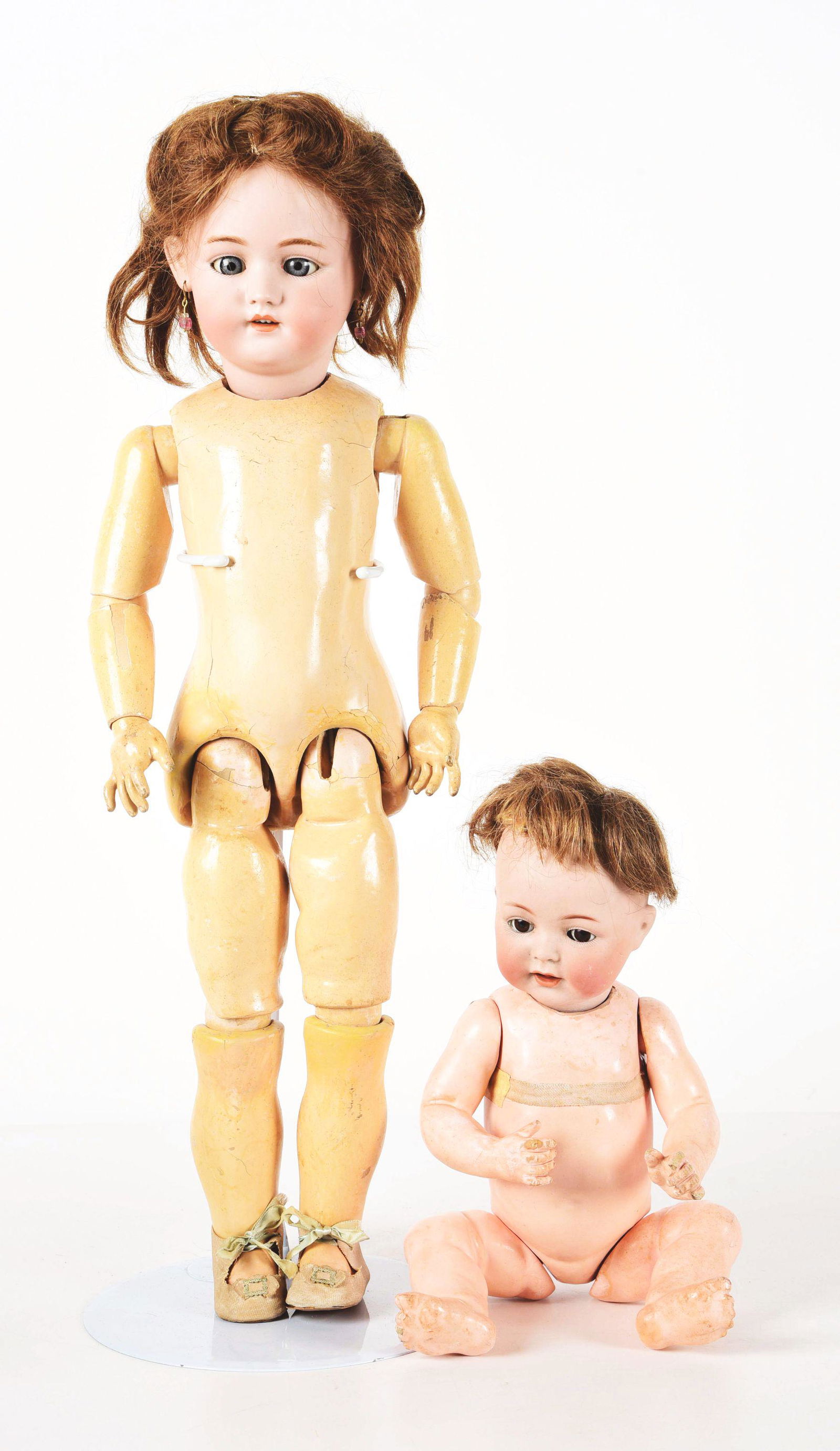 LOT OF 2: GERMAN BISQUE HEAD DOLLS.: Included are a 24" bisque socket head child doll, incised on back of head "Simon & Halbig Dep 1079 Germany 11 1/2". She has blue glass sleep eyes, an open mouth with four upper teeth, and is on the or