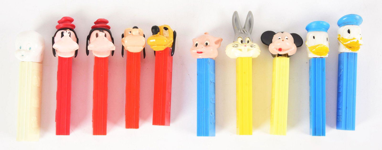 LOT OF 10: PEZ FIGURES.: Includes a grouping of Disney and other characters. Condition: (Excellent). Dimensions: Each: 1 - 1/2" x 1 - 1/2" x 4 - 1/4".