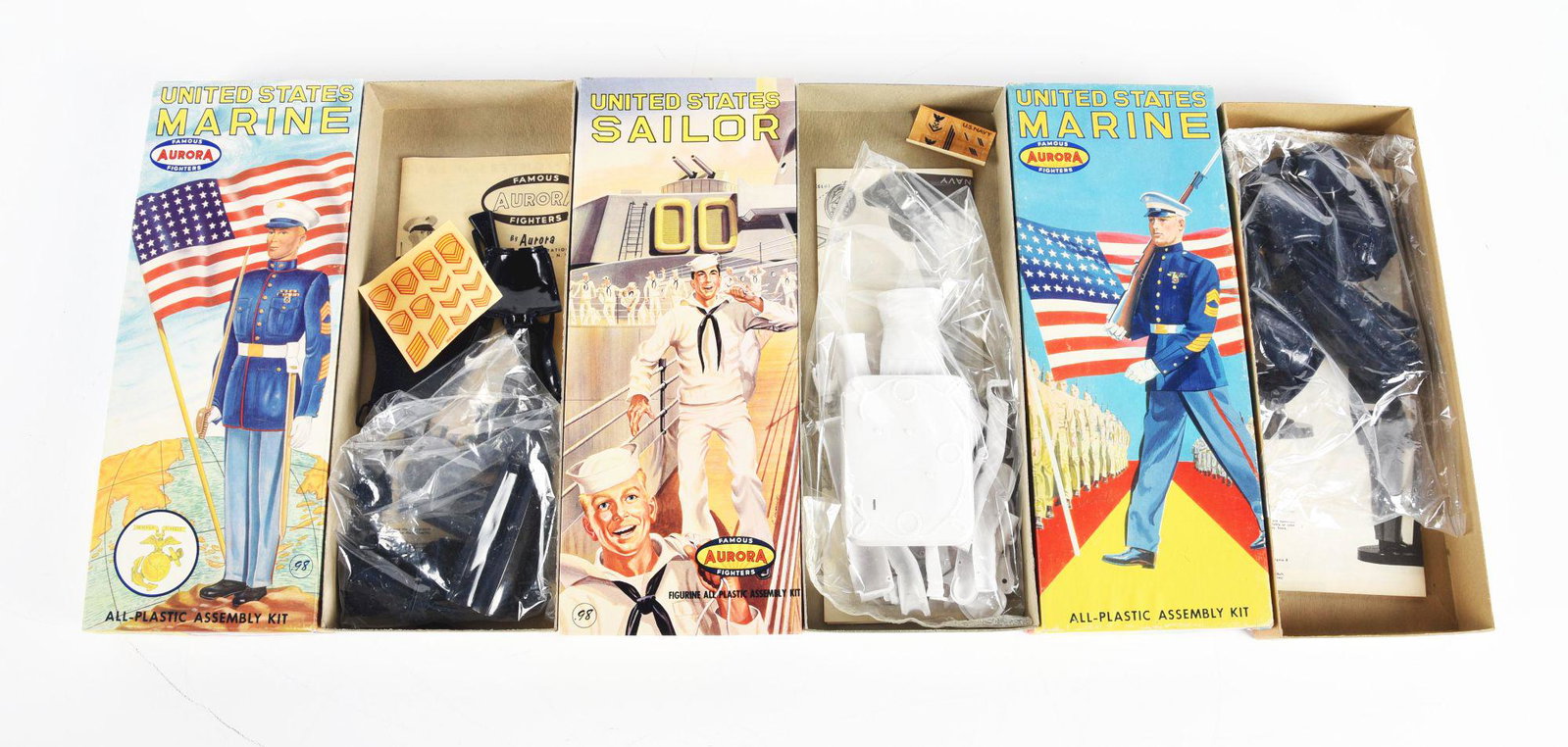 LOT OF 3: AURORA U.S. MILITARY FIGURE MODEL KITS IN BOXES.: Lot of three includes a United States Sailor with parts inside the box sealed in plastic, a United States Marine holding a rifle also with parts sealed in plastic inside box and the last is a United S
