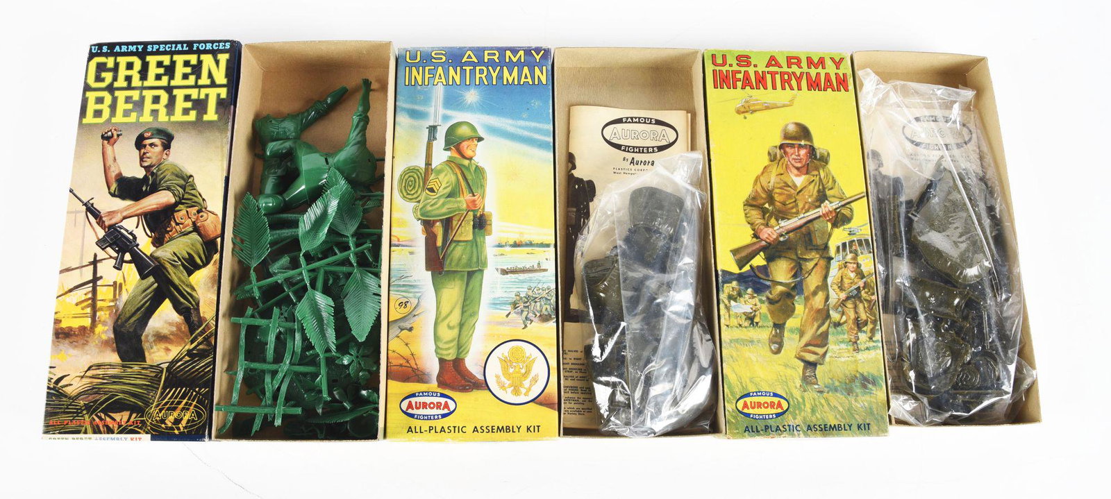 LOT OF 3: AURORA U.S. ARMY FIGURE MODEL KITS.: All in original boxes. There is a Green Beret and two U.S. Army Infantrymen, one running with rifle and the other holding rifle. Two have parts sealed in original plastic, the other has parts in plast