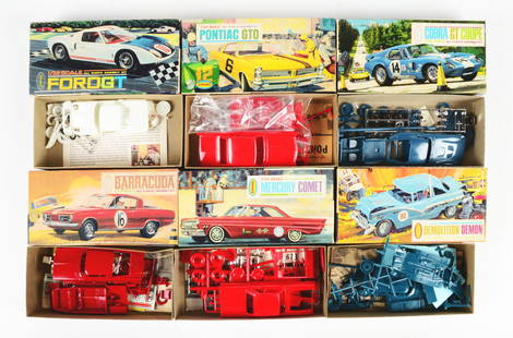 LOT OF 6: VINTAGE AURORA AUTOMOBILE MODEL KITS.: All in original boxes, 1:32 scale, all unbuilt and look to be complete. There is a Demolition Demon, a Mercury Comet, a Pontiac GTO, a Barracuda, a Ford GT and a Cobra GT Coupe. Some slight box shelf