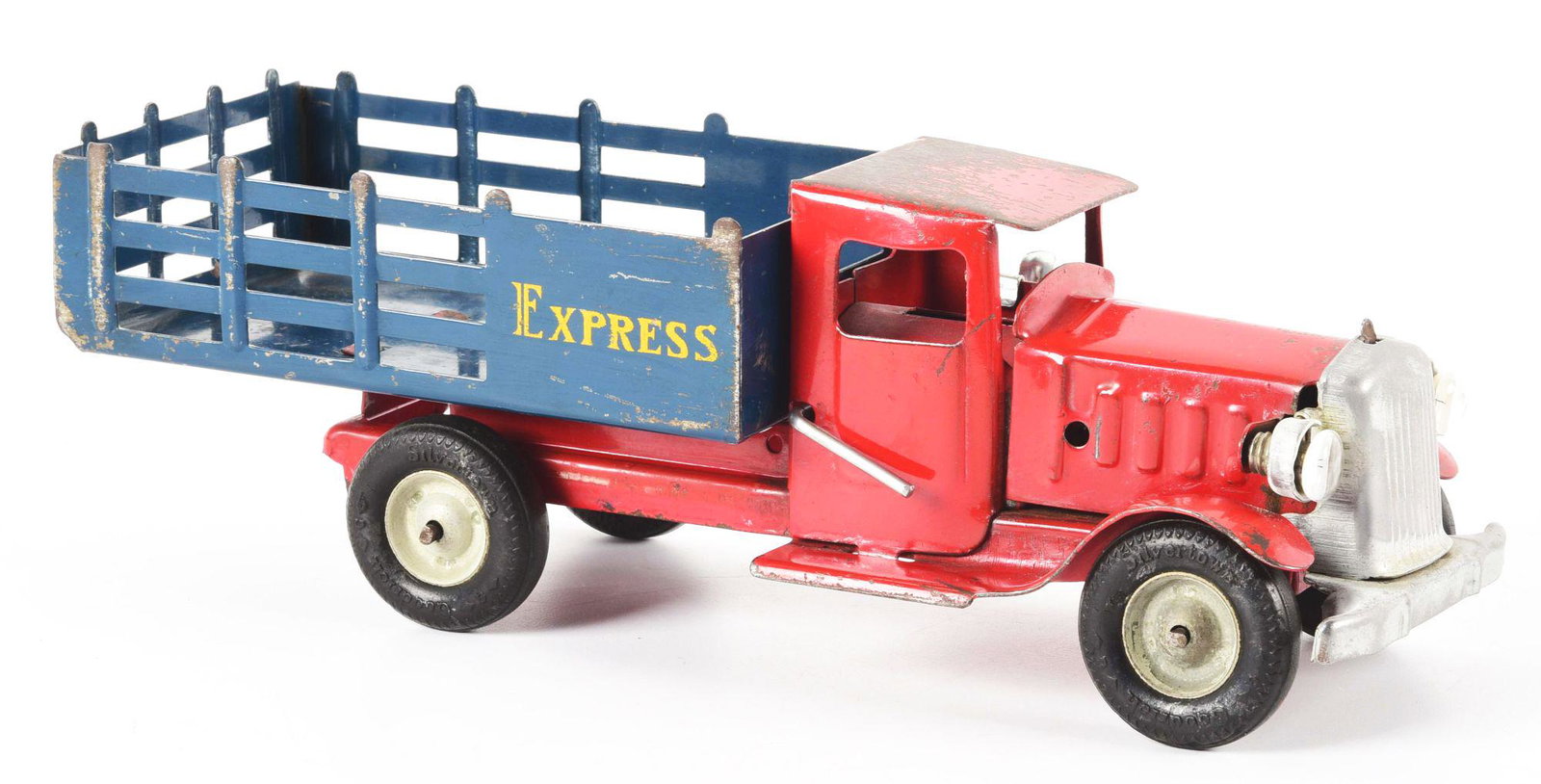 METALCRAFT PRESSED STEEL STAKEBACK EXPRESS TRUCK.: Battery-operated headlights, black rubber tires. Some oxidation to front grille. Some paint loss to cab roof. Condition: (Good - Very Good). Dimensions: 12 - 1/4" x 4 - 1/4" x 4".