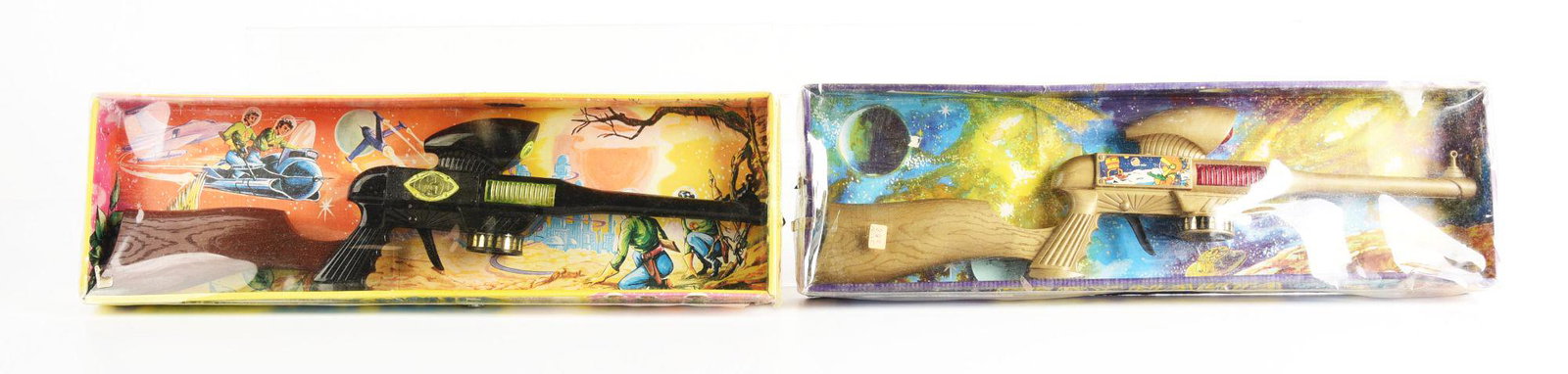 LOT OF 2: TWO VINTAGE SPANISH SPACE RIFLES IN ORGINSL BOXES.: Marked Perry- Nauta. Nice decals and space scenes. Condition: (Very Good - Excellent). Dimensions: Largest Box: 6 - 1/2" x 21 - 1/2" x 2"