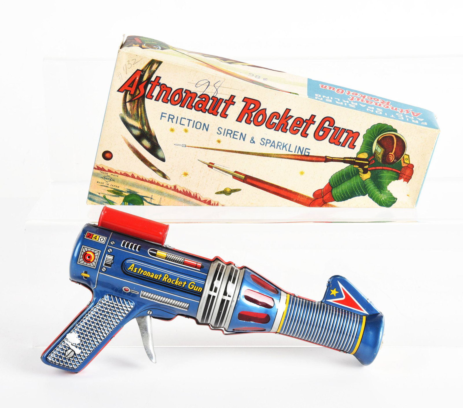 JAPANESE TIN LITHO FRICTION ASTRONAUT ROCKET GUN.: In original box. Nice colorful litho, marked "Astronaut Rocket Gun" with sight on top. Friction action. Original box has nice graphics. Made by Daiya Japan. Condition: (Very Good - Excellent). Dimensi