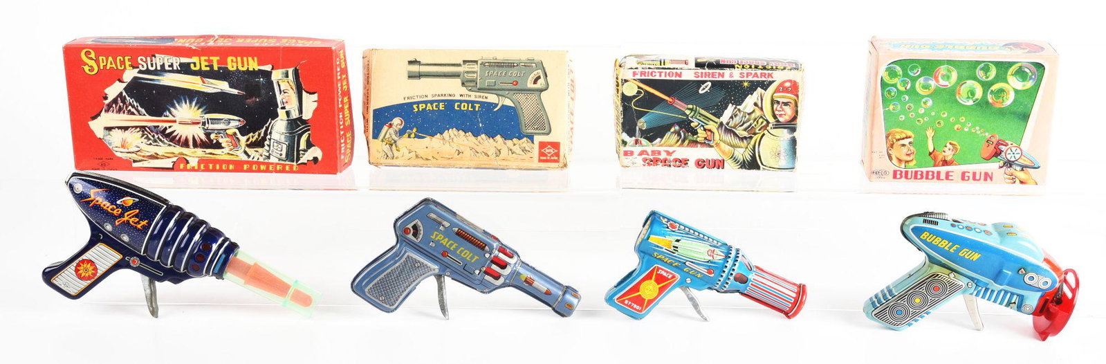 LOT OF 4: JAPANESE SPACE GUNS IN ORIGINAL BOXES.: There is a space colt, baby space gun, super jet gun, and a bubble gun. Condition: (Very Good - Excellent). Dimensions: Largest Box: 9 - 1/4" x 4 - 1/2" x 1 - 3/4".