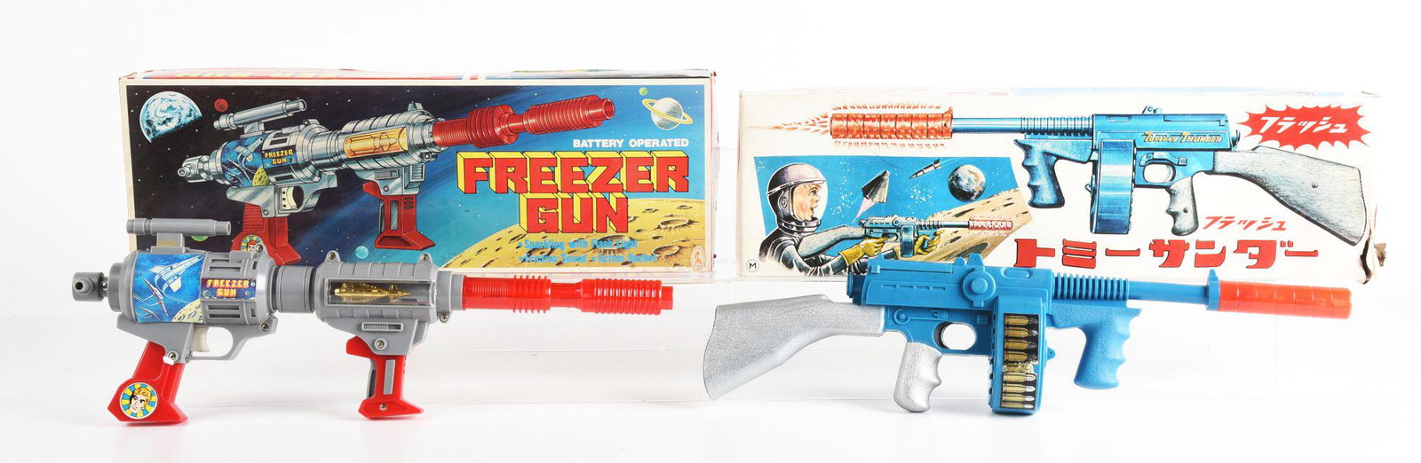 LOT OF 2: JAPANESE & HONG KONG BATTERY OPERATED SPACE RIFILES.: Have inserts. There is a Tommy Thunder Gun and a freezer gun. Some slight tearing and creasing to boxes. Condition: (Very Good - Excellent). Dimensions: Largest Box: 20 - 3/4" x 6" x 3 - 1/4".