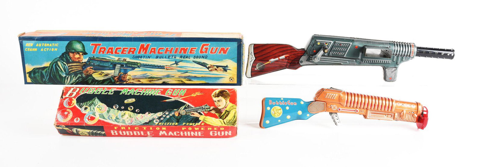 LOT OF 2: JAPANESE TIN LITHO MACHINE GUN TOYS IN ORIGINAL BOXES.: Both friction powered. Bubble machine gun and a tracer machine gun. Condition: (Very Good - Excellent). Dimensions: Largest Box: 21" x 4 - 3/4" x 4 - 1/4".