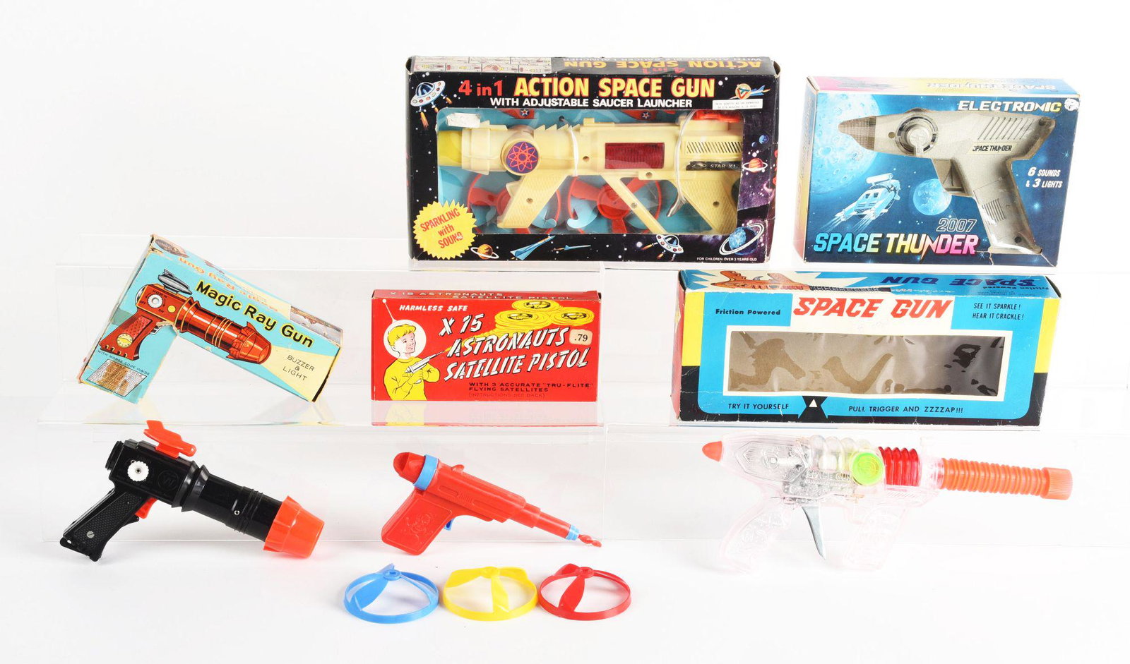 LOT OF 5: VARIOUS FRICTION & BATTERY OPERATED PLASTIC SPACE GUNS PISTOLS.: Mostly made in Hong Kong and Taiwan. There is a space thunder gun and magic gun. Condition: (Very Good). Dimensions: Largest Box: 12 - 1/4" x 6 - 1/2" x 2".