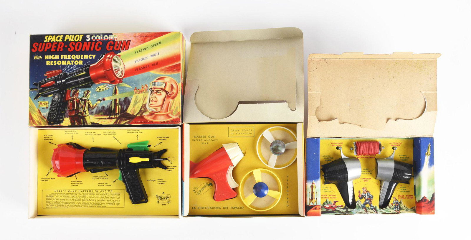 LOT OF 3: MADE IN ENGLAND SPACE TOYS IN ORIGINAL BOXES.: Space pilot super sonic ray gun, master gun, and a pair of space patrol walkie talkies. Colorful boxes. Condition: (Very Good - Excellent). Dimensions: Largest Box: 11 - 1/4" x 7" x 2 - 1/2".