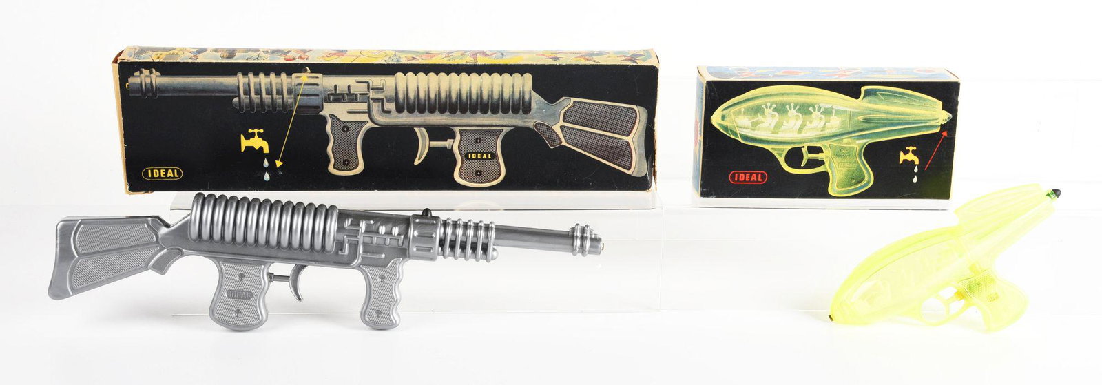LOT OF 2: IDEAL PLASTIC SPACE GUNS IN ORIGINAL BOXES.: One space rifle with great graphics to box and a space pistol with plastic Martians inside. Condition: (Very Good - Excellent). Dimensions: Largest Box: 19 - 3/4" x 5 - 1/4" x 2".