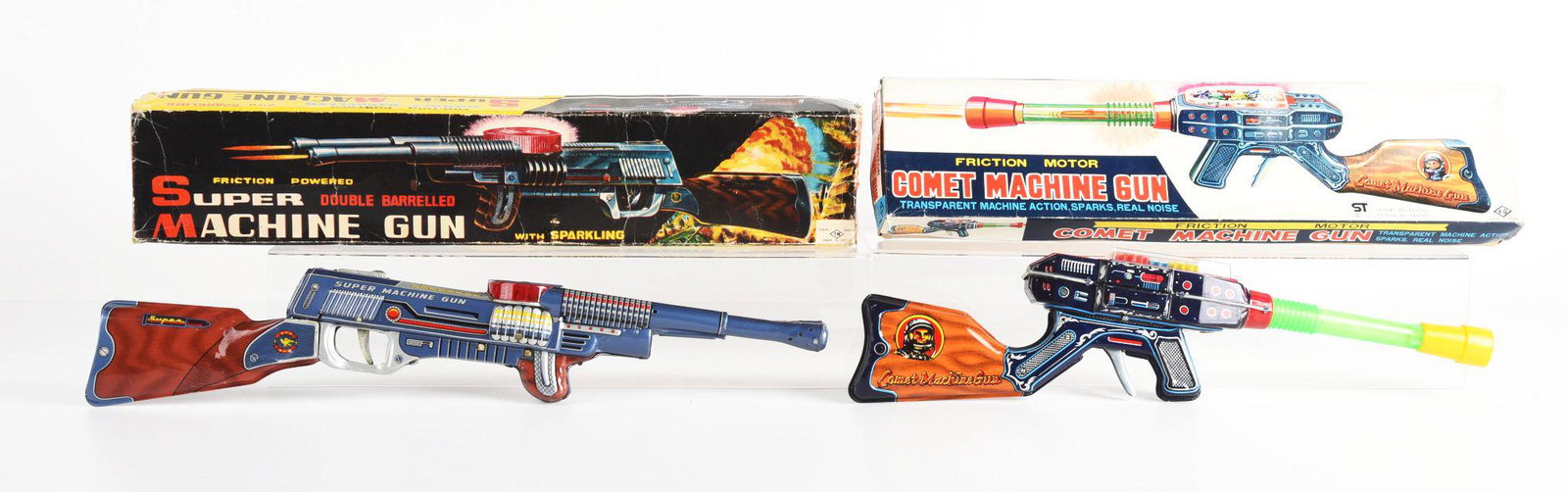 LOT OF 2: JAPANESE TIN LITHO & PLASTIC SPACE RIFLES.: One is marked T. N Namora Japan and KO Japan. One marked comet machine gun and other marked super machine gun. Some wear on boxes. Condition: (Very Good - Excellent). Dimensions: Largest Box: 21 - 1/2