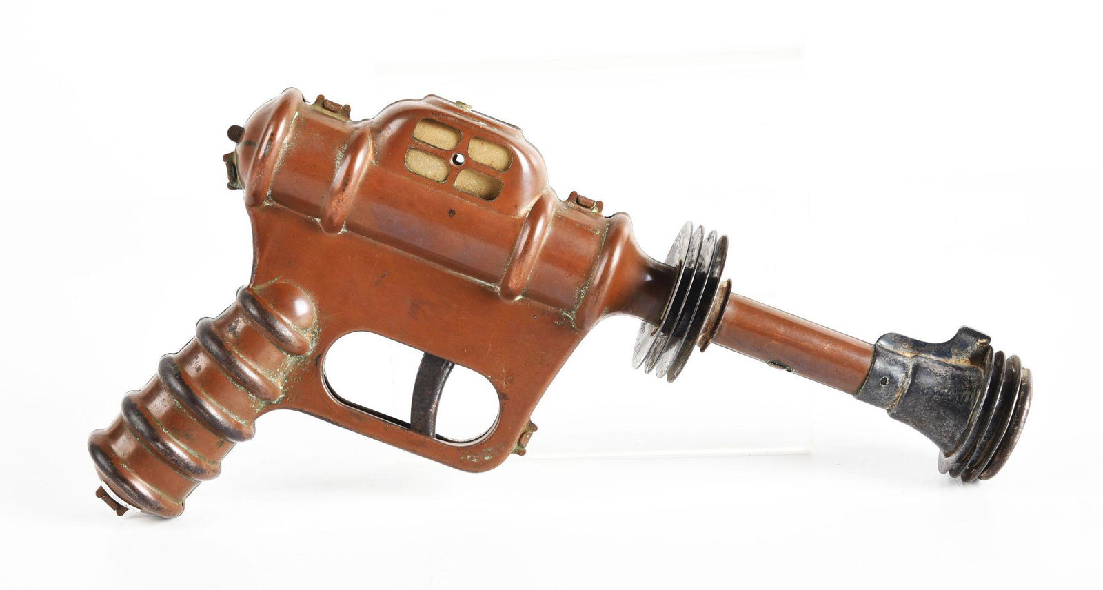 DAISY BUCK ROGERS DISINTEGRATOR GUN.: Working. Scarcer copper finish model. Some wear. Condition: (Very Good). Dimensions: 9 - 1/2" x 5 - 3/4 x 1 - 1/2".