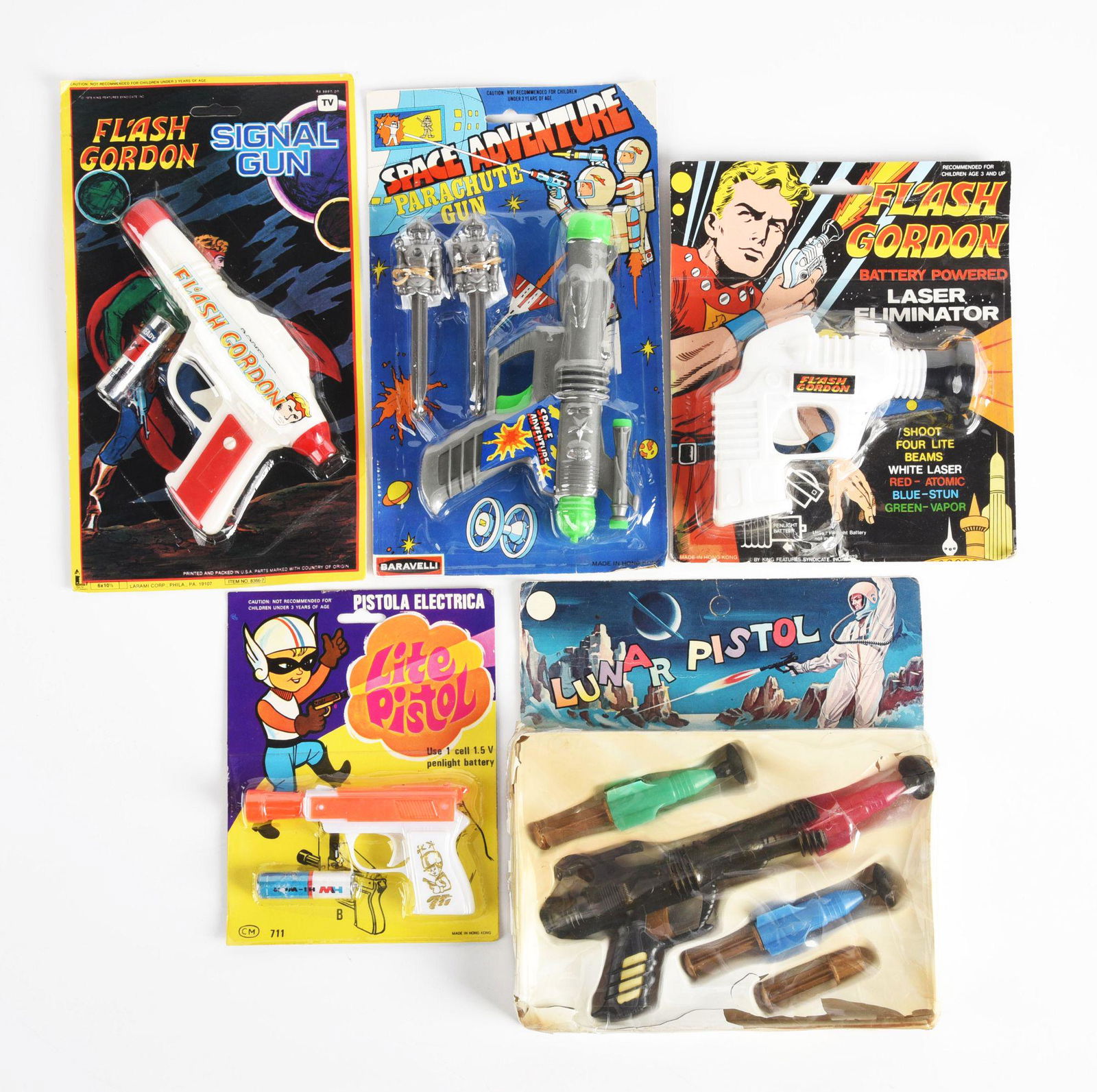 LOT OF 5: MOSTLY MADE IN HONG KONG PLASTIC SPACE PISTOLS ON ORIGINAL CARDS. (1 of 2)