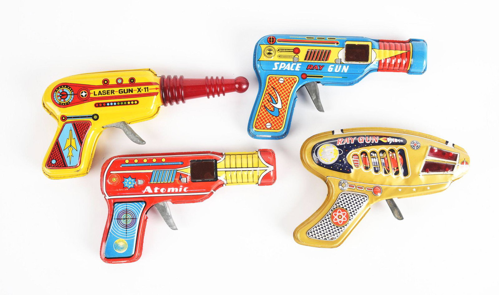 LOT OF 4: JAPANESE TIN LITHO RAY GUNS.: Includes laser gun, atomic gun, and two other ray guns. Condition: (Very Good - Excellent). Dimensions: Largest: 8" x 4" x 1" .