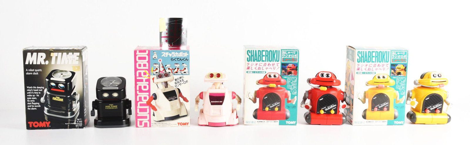 LOT OF 4: TOMY ROBOTS IN ORIGINAL BOXES.: Mister Time and 3 Shaberokus. Condition: (Very Good - Excellent). Dimensions: Largest Box: 9" x 6 - 1/2" x 4 - 3/4".