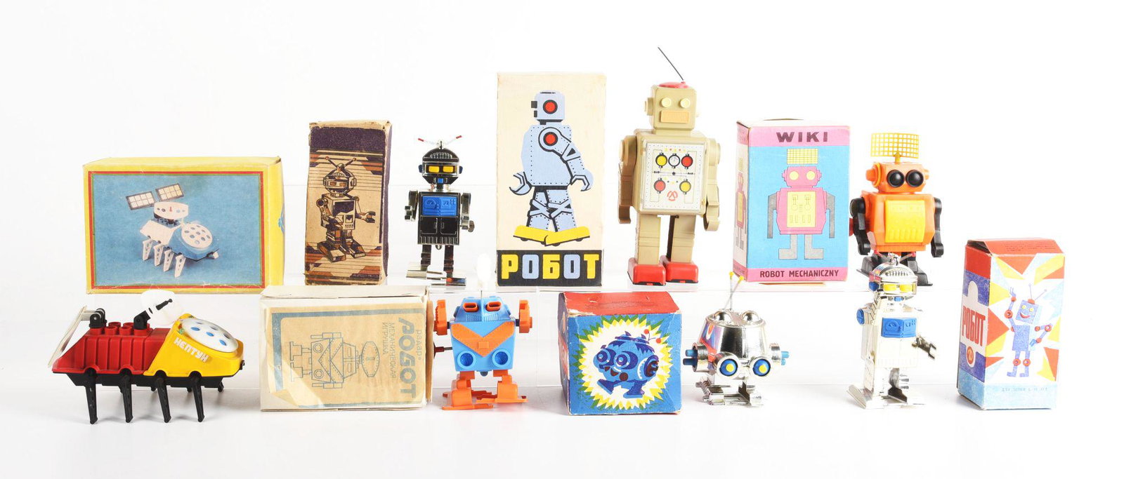 LOT OF 7: VARIOUS FOREIGN MADE PLASTIC ROBOTS.: All original boxes. Condition: (Very Good). Dimensions: Largest Box:7 - 1/2" x 5 - 1/4" x 4".