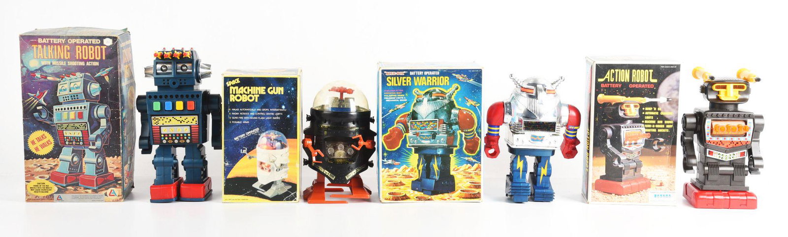 LOT OF 4: BATTERY OPERATED HONG KONG ROBOTS.: All original boxes. Talking robot, silver warrior, machine gun robot, and an action robot. Condition: (Very Good - Excellent). Dimensions: Largest Box: 13" x 7 - 1/4" x 4 - 1/4".