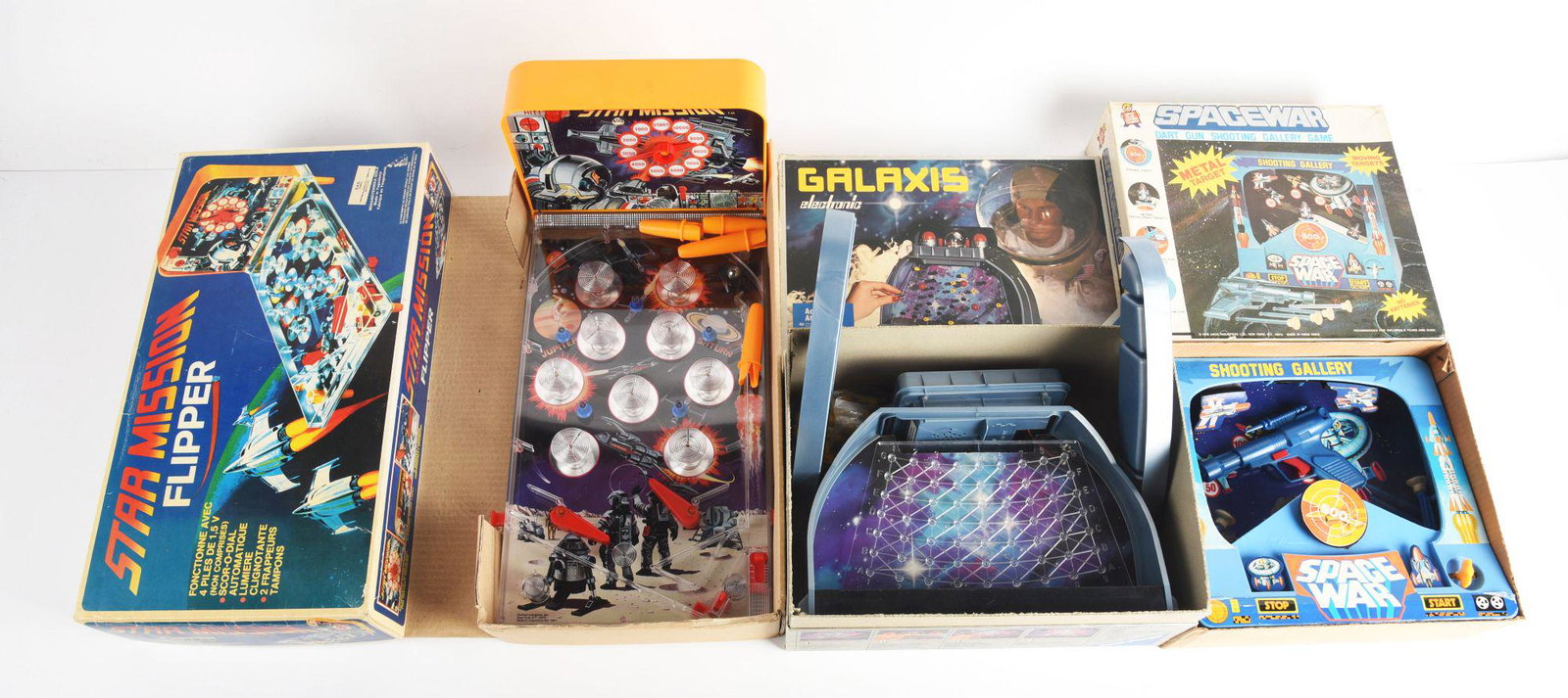 LOT OF 3: ELECTRONIC & WIND UP SPACE RELATED GAMES IN ORIGINAL BOXES.: One is a star mission flipper pin ball game made in Yugoslavia. There is a German Gelexix battery operated game and a arco space war dart gun shooting gallery game made in Hong Kong. Condition: (Very 