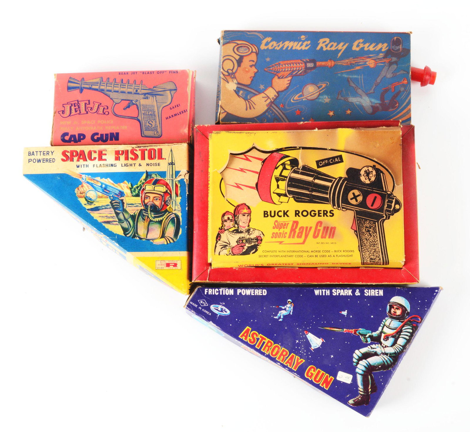 LOT OF 5: VARIOUS AMERICAN, KOREAN AND JAPANESE-MADE SPACE PISTOLS.: Some plastic, some metal, some cast. All in original boxes, some missing flaps and with some tearing and creasing. Includes a Cosmic Ray Gun by Ranger Steel, a Buck Rogers Supersonic Ray Gun, a Korean