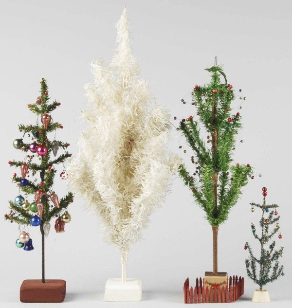 Lot of 4: Fir-Type Christmas Trees.: ADDITION – Includes one white 1950s with original label, and 3 green. One is metallic tinsel with berries, one has miniature ornaments, and one is a real old German feather tree with bead garland. C