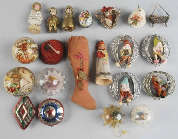 Lot of Christmas Pieces and Ornaments .: Includes several candy containers with bisque figures on them, several Santa figures wrapped in silver foil with elves, a chenille bell, a stocking, a little girl dressed in spun glass, a paper mache 