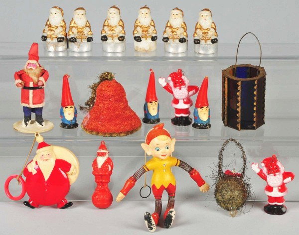Lot of Assorted Christmas Pieces.: Includes party favor Japanese Santa, early Japanese celluloid Santa, several plastic Santas, one elf-type character, three Santa candles, one wire-wrapped glass ornament, and other items. Condition (V