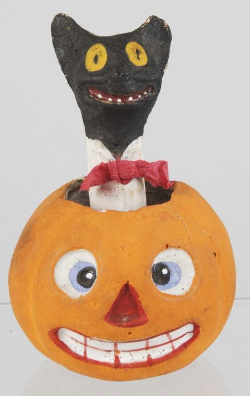 Halloween Jack-O-Lantern.: Marked ""Germany"". Depicts cat coming out of pumpkin. Condition (Excellent). Size 4 - 1/4"" T."