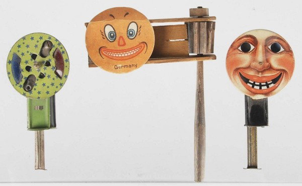 Lot of 3: Halloween Noisemakers.: All are working well. Includes one wooden noisemaker marked ""Germany"", one tin sparkler with pumpkin man face, and second sparkler. Condition (Excellent). Size Largest: 6"" T."