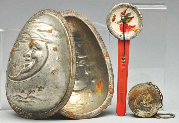 Lot of 3: Halloween Pieces.: Includes one rare large chocolate candy mold with quarter moon, one rare witch noisemaker marked ""Germany"", and one extremely rare makeup kit in metal box with embossed jack-o-lantern. The well made