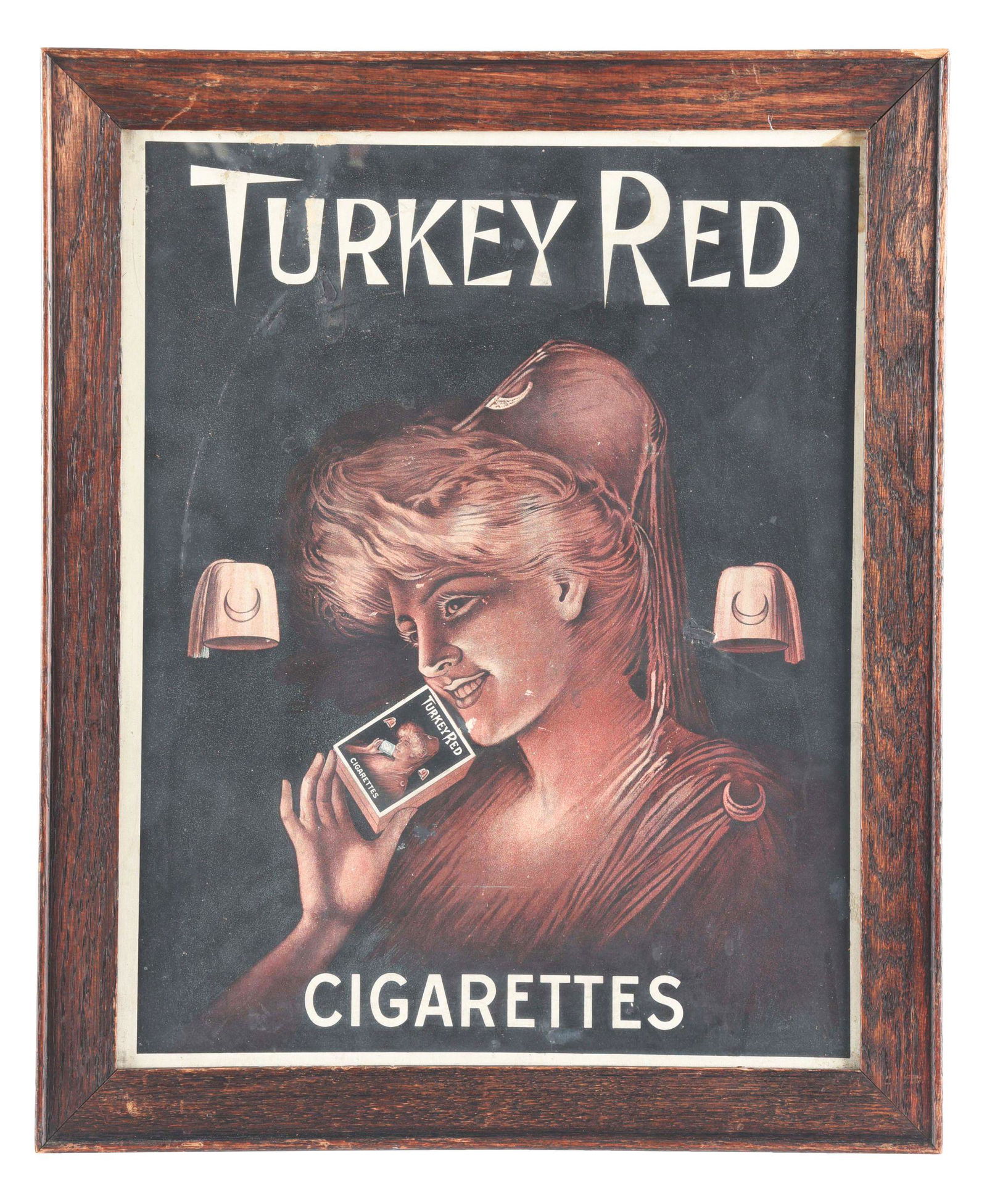 FRAMED CARDBOARD ADVERTISEMENT FOR TURKEY RED CIGARETTES. (1 of 3)