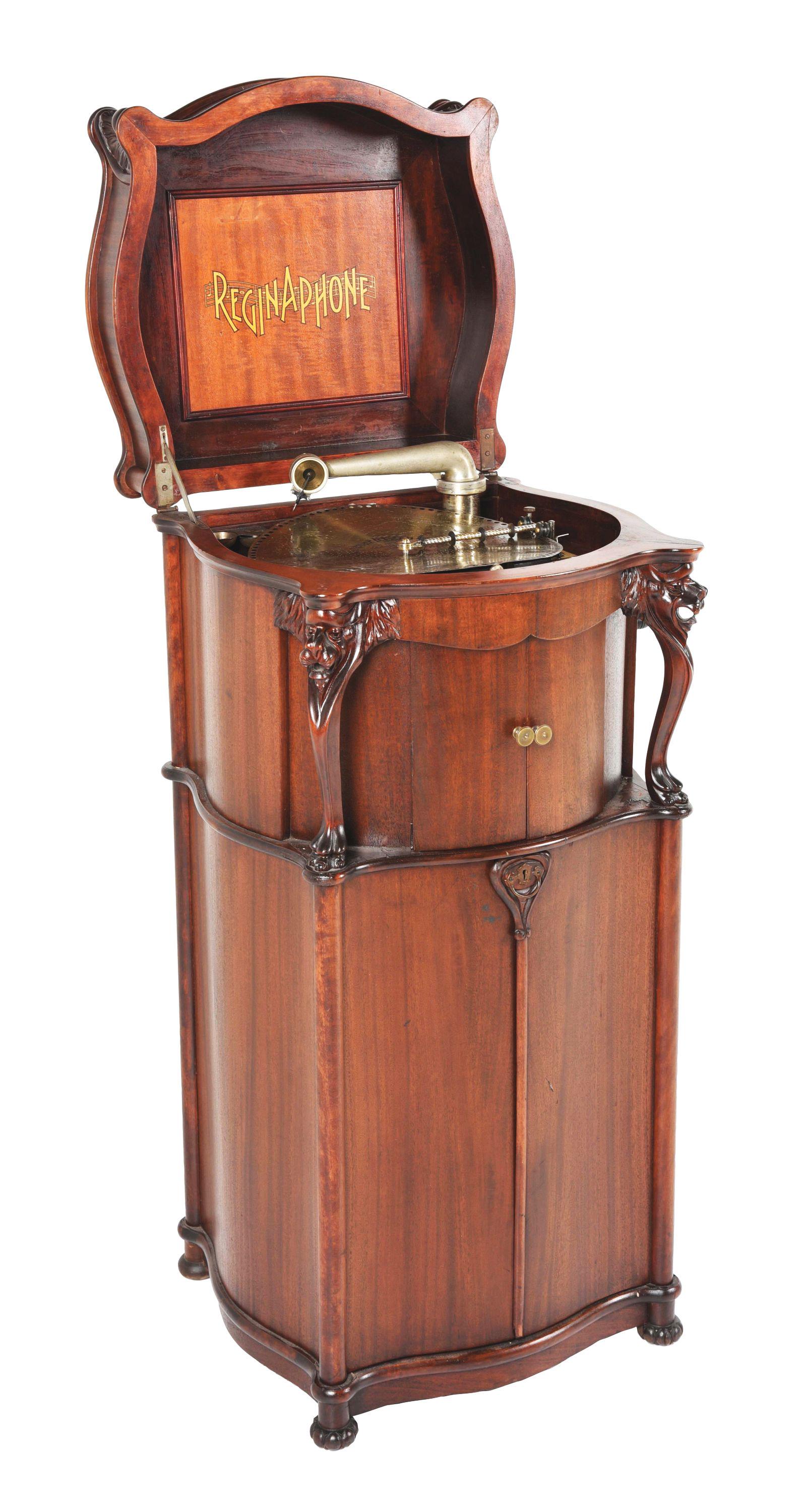 REGINAPHONE STYLE 240 COMBINATION MUSIC BOX AND PHONOGRAPH.: This Regina Style 240 has the carved dragon accents as opposed to the turned columns, which was an option. The music box is complete and working, the phonograph turntable is present and original, incl