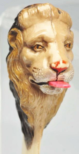 Lion Head Figural Tape Measure.: German. Celluloid. The lion's tongue is the pull for the spring tape. Condition (Excellent). Size 7" L.