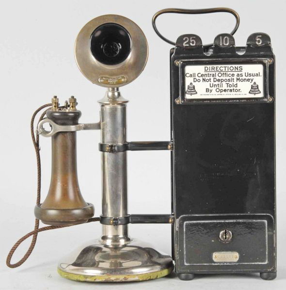 Western Electric 20B with Coin Collector.: Circa 1910. Includes a Gray coin collector. Nickel and black, 259W transmitter, outside wire, pony receiver, keys for coin drawer and back plate. Last patent date 1909 for the lead coin chutes. Condit