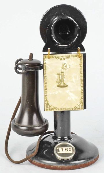 Black Western Electric Manual Stick Phone.: Circa 1925. Black over brass, hanging directory with insides missing, number card in the base, 323 transmitter, and some paint loss. Condition (Excellent). Size 11" T.