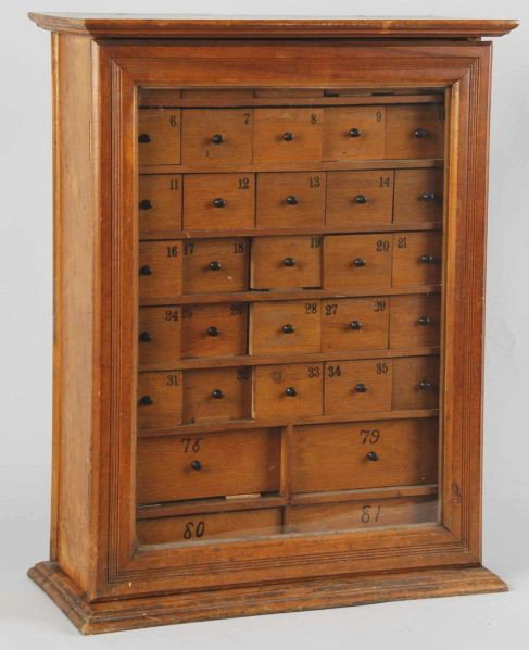 Humphreys' Specifics Remedies Cabinet.: Circa 1890. Tin front with clear glass back. Contains numbered drawers accessible from the back that correspond to the specific homeopathic remedies numbered on the front. Original finish. Lot include