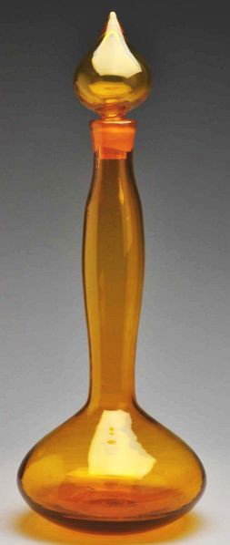 Tall Amber Glass Floor Decanter.: Circa 1958. Large amber blown glass floor decanter with bulbous base and tall neck. Ground neck and tear-drop hollow stopper. Rough pontil. Appears in Blenko Glass Company's 1958 catalog (item 5815-L)