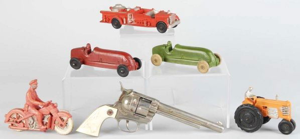 Lot of 6: Auburn Rubber Vehicles & Cap Gun.: Includes one Hubley Cowboy cylinder gun that has been heavily used and five Auburn vehicles in various conditions. Condition (Very Good). Size Largest: 11" L.