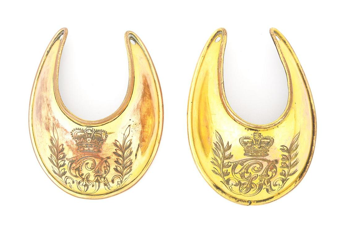 LOT OF 2: NAPOLEONIC GORGETS.: Lot consists of 2 1796 Pattern British Gorgets with classical "GR" with flanking laurels surmounted by a crown. Faces with gilt brass, reverses with folded edges, copper base showing, and marks from t