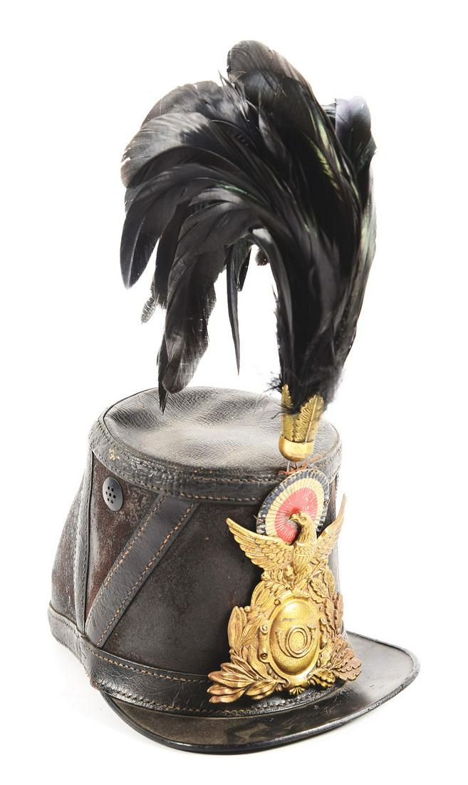 CIVIL WAR IMPORT FRENCH CHASSEUR SHAKO WITH PLUME.: Early in the war the U.S. imported 10,000 French uniform sets through the firm of Godillot that included chasseur style jackets and these 1860 pattern shakos. This one still has its US front plate wit
