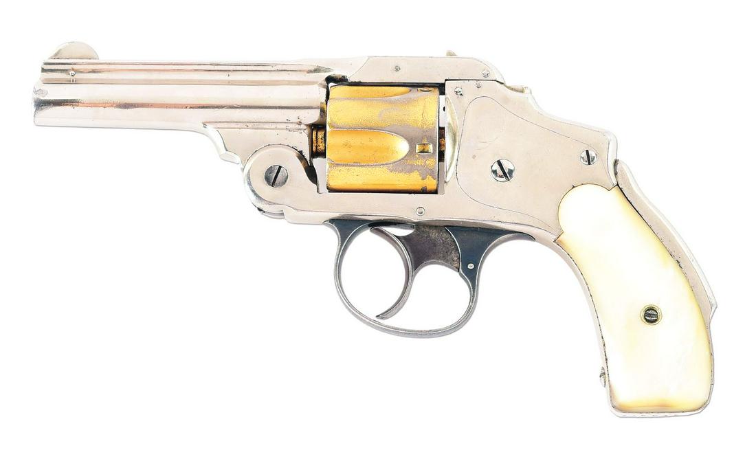 (A) SMITH & WESSON .38 SAFETY HAMERLESS SECOND MODEL REVOLVER.: Manufactured between 1887 - 1890. This gun sports a 3 - 1/4" round ribbed barrel with a pinned half moon front sight and a U notch rear sight. Nickel plated with a gold washed 5-shot fluted cylinder.
