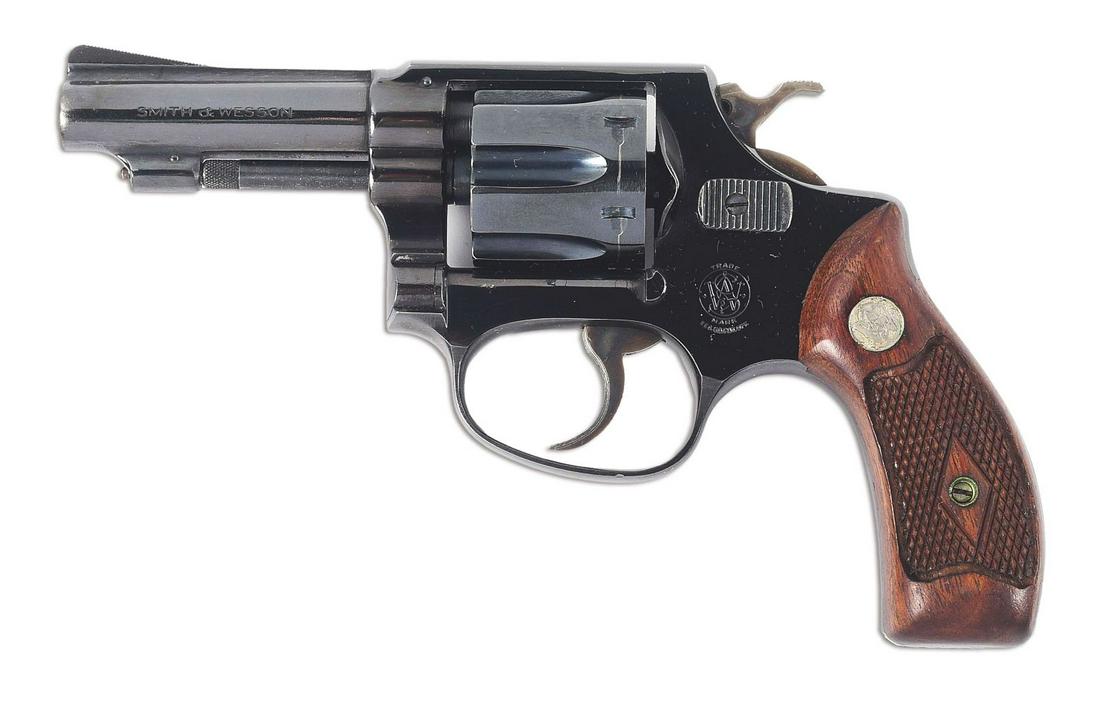 (C) SMITH & WESSON .32 HAND EJECTOR DOUBLE ACTION REVOLVER.: Round ribbed barrel with a serrated ramp front sight and a square notch rear sight. Swing out 6-shot fluted cylinder. Flat latch with a round butt grip. Checkered wood grips with the S&W medallions at