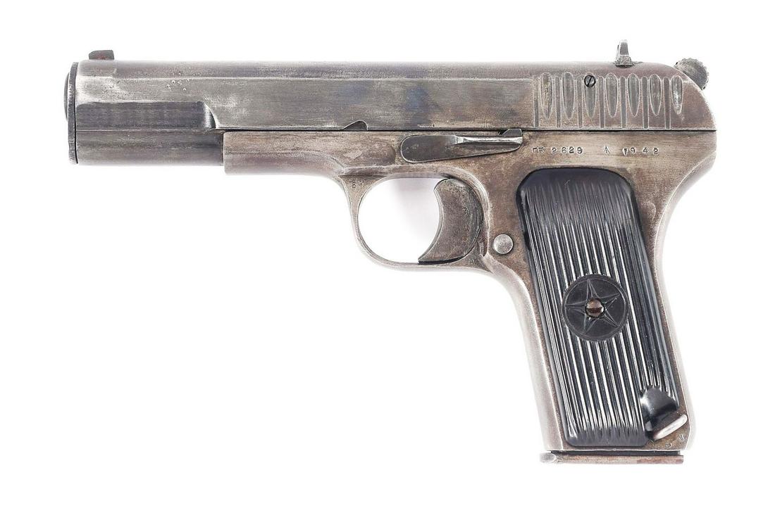 (C) DESIRABLE RUSSIAN WORLD WAR II IZHEVSK ARSENAL "1942" DATE TT-33 TOKAREV SEMI-AUTOMATIC PISTOL: TT-33 semi-automatic pistol manufactured at the Izhevsk Factory 74 during World War II. The left side of the frame bears the serial number, followed by the Izhevsk arsenal logo and the year of manufac