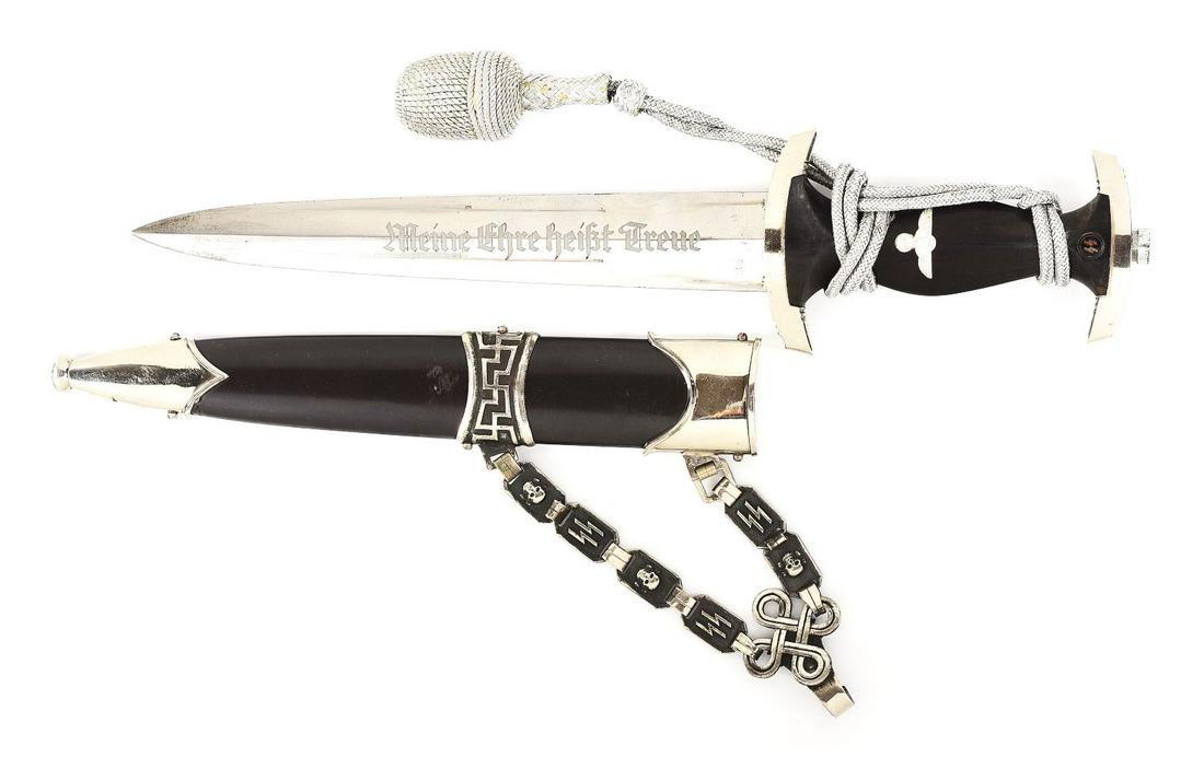 THIRD REICH TYPE B2 CHAINED SS DAGGER.: Third Reich M36 chained SS dagger known by collectors as a "Type 2B". The blade is unmarked and exhibits fine original factory cross graining, with light runner and scattered marks, as well as tiny da