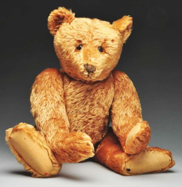 Apricot Center Seam Steiff Bear.: Description Circa 1905. With blank button, original photo, and scarf. Stunning original example. Condition (Excellent). Size 28" L.