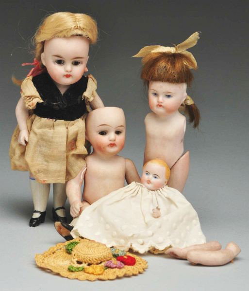 Lot of 4: German All Bisque Dolls.: Description Kestner 150 child (no wig), glass eyes, pouty mouth, original dress; Kestner 250 pouty child, sleeping eyes, original blonde mohair wig; Kestner 150 girl with painted eyes (needs restringi