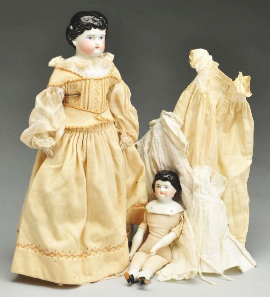 Lot of 2: German China Dolls.: Description Both unmarked Alt, Beck & Gottschalck 'Highland Mary" heads with molded black hair, brush strokes on bangs and temples; larger with old cloth body but replaced lower legs and leather arms,