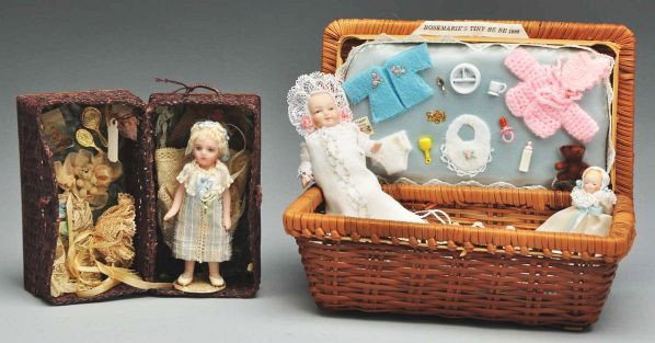 Small Artist Dolls with Layettes.: Description Cathy Hansen all- bisque Bru Repro, curly wig, original clothing, in wicker basket with extra dress, hat and accessories; Rosemarie's tiny baby, all bisque with christening robe and access